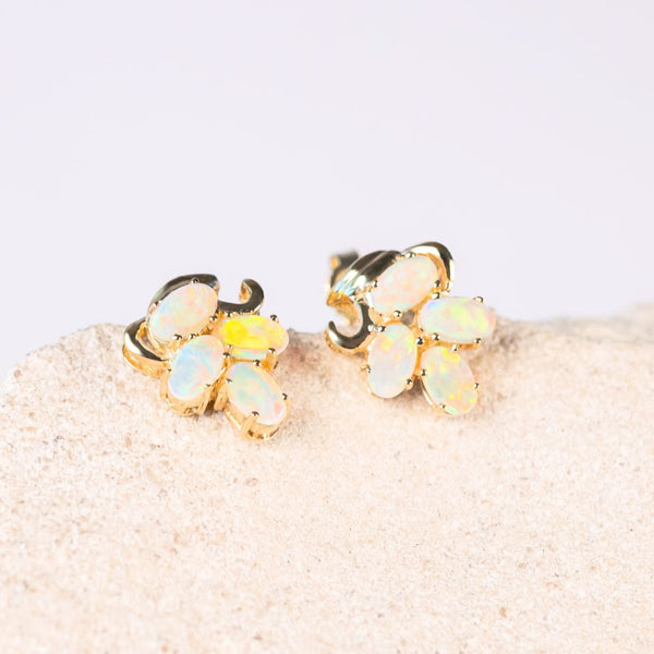 four colourful crystal opals in each gold earrings