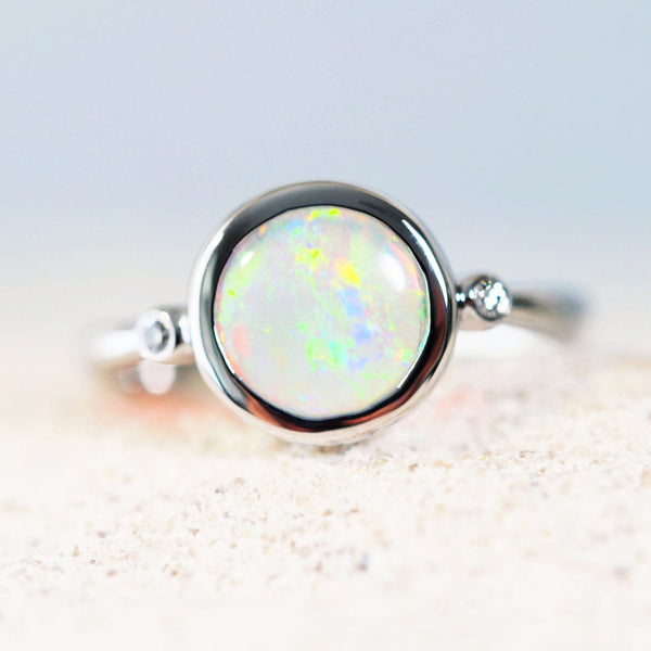 multi-colour crystal opal ring set in white gold with two white shoulder-set diamonds