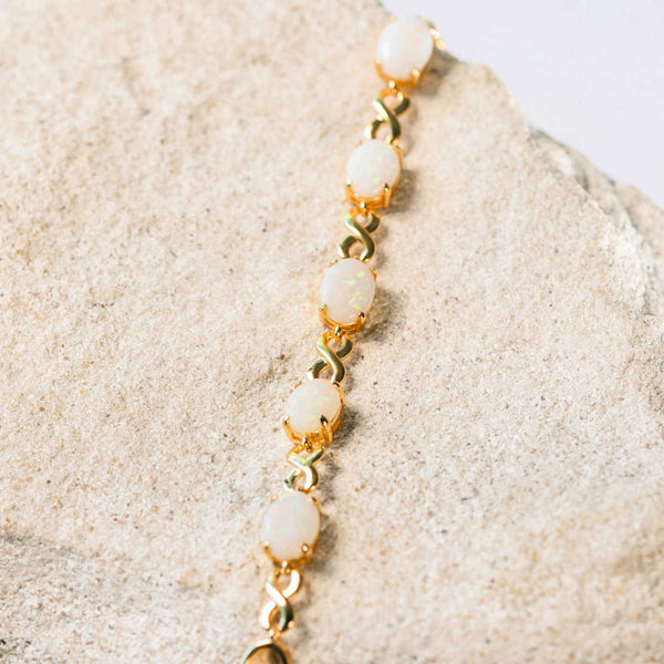 white opal bracelet in gold plated silver in an eternity design