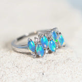 australian crystal opal ring set in white gold with six diamonds