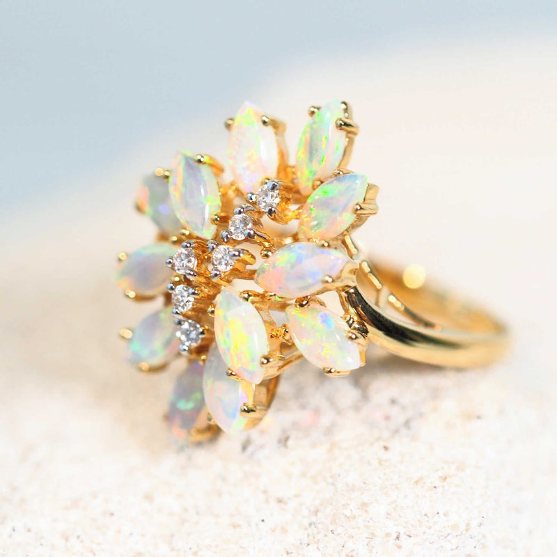 colourful australian opal ring in 18ct gold with six diamonds