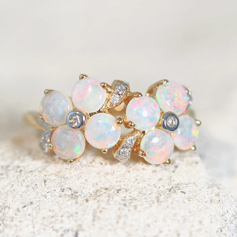 pink, blue and green crystal opal ring in a flower design